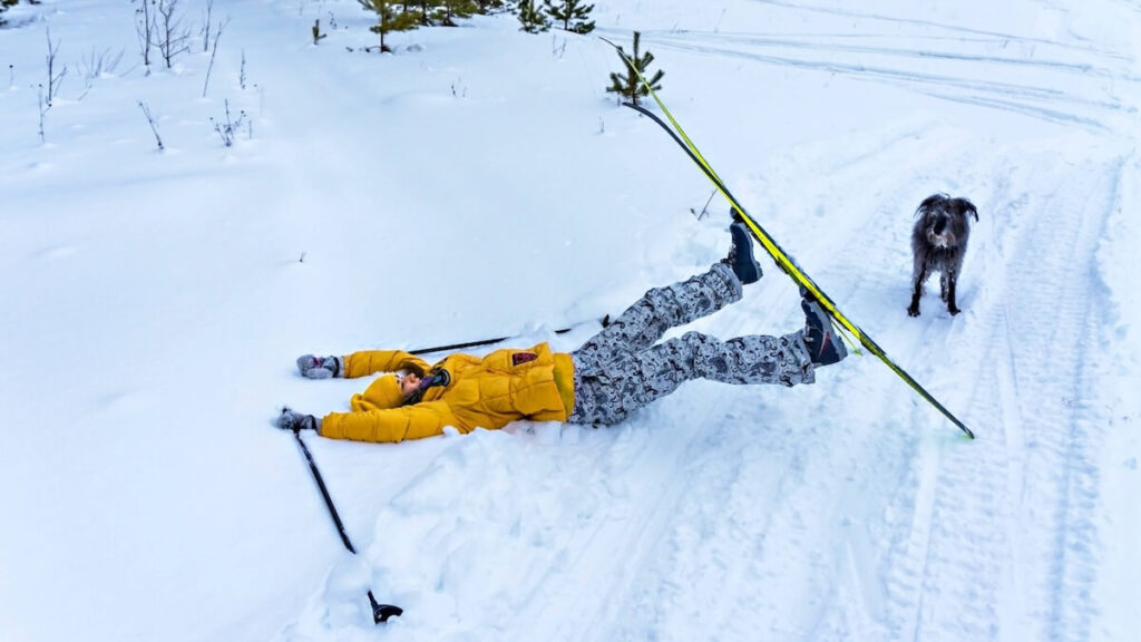 Person falling over while skiing