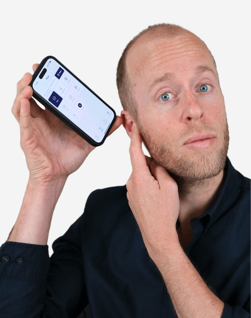 A smartphone screen displaying the Still Tinnitus app interface, showing sound therapy options such as rain, campfire, and crickets, representing a tool used to support tinnitus management and relaxation.